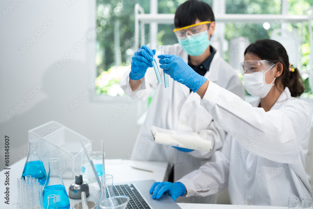 Fototapeta premium Health care researchers working in life science laboratory, medical science technology research work for test a vaccine, coronavirus covid-19 vaccine protection cure treatment