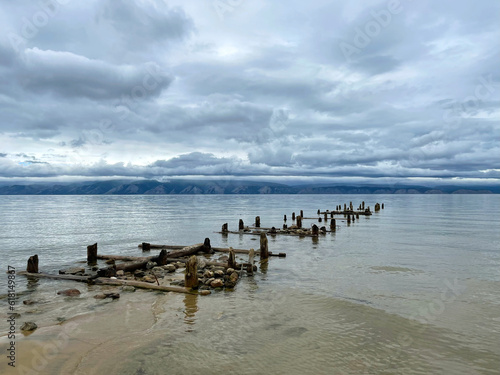 Old ruined pier on the shore of Lake Baikal, Olkhon, Russia