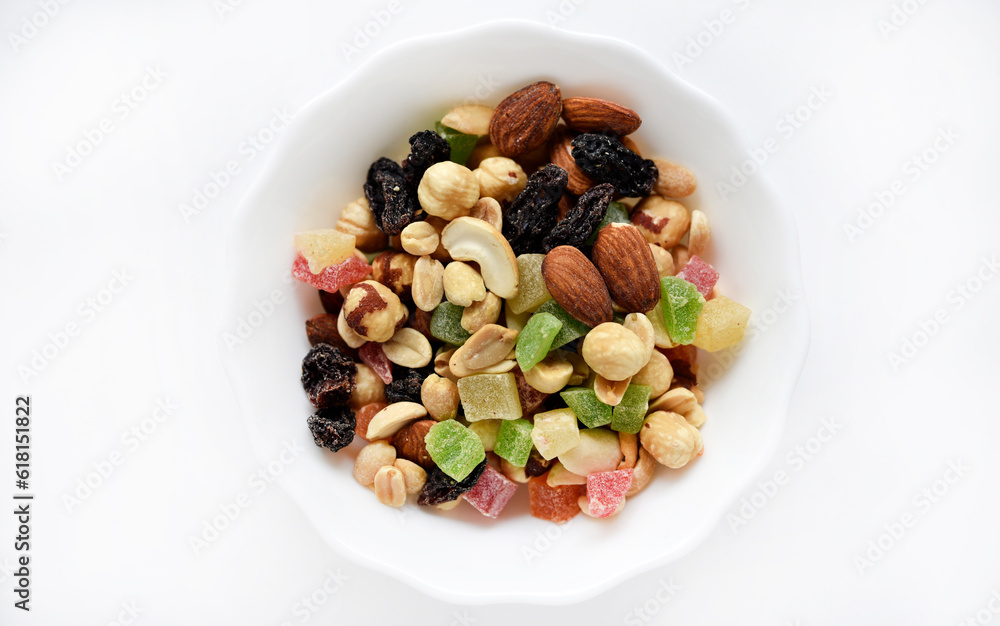 Nut mixture in a cup. A delicious snack of nuts and dried fruits. Nut mixture in a cup. A delicious snack of nuts and dried fruits.