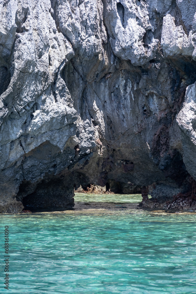 Amazing views from a boat trip in the rocky islands and cliffs in El Nido, Palawan, touristic destination in the Philipines. Turquoise crystal clear sea, scenic views.