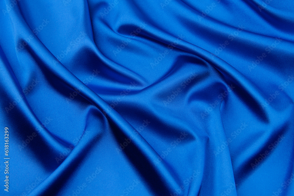 Blue satin or silk fabric as background Blue satin or silk fabric as background