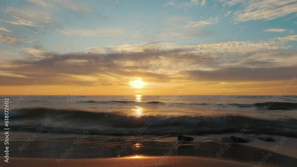 Timelapse View of the Baltic Sea at Sunset, Pavilosta, Latvia. Beautiful Golden Sunset Over the Beach Seascape. Glittering Sunlight Reflection. The Baltic Sea at the Mouth of Saka River in Courland Timelapse View of the Baltic Sea at Sunset, Pavilosta, Latvia. Beautiful Golden Sunset Over the Beach Seascape. Glittering Sunlight Reflection. The Baltic Sea at the Mouth of Saka River in Courland