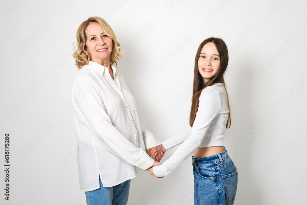 portrait of grandmother carrying her grandchild isolated on white portrait of grandmother carrying her grandchild isolated on white