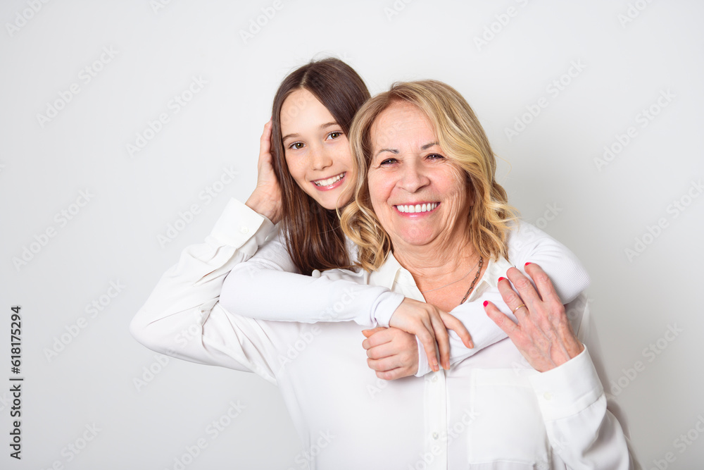 portrait of grandmother carrying her grandchild isolated on white portrait of grandmother carrying her grandchild isolated on white