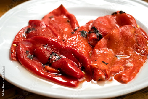 Traditional Balkan salad - grilled sweet peppers with oil, garlic and vinegar