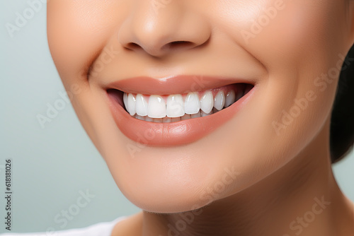 A close - up image of a woman's mouth ,perfect white smile and white teeth.