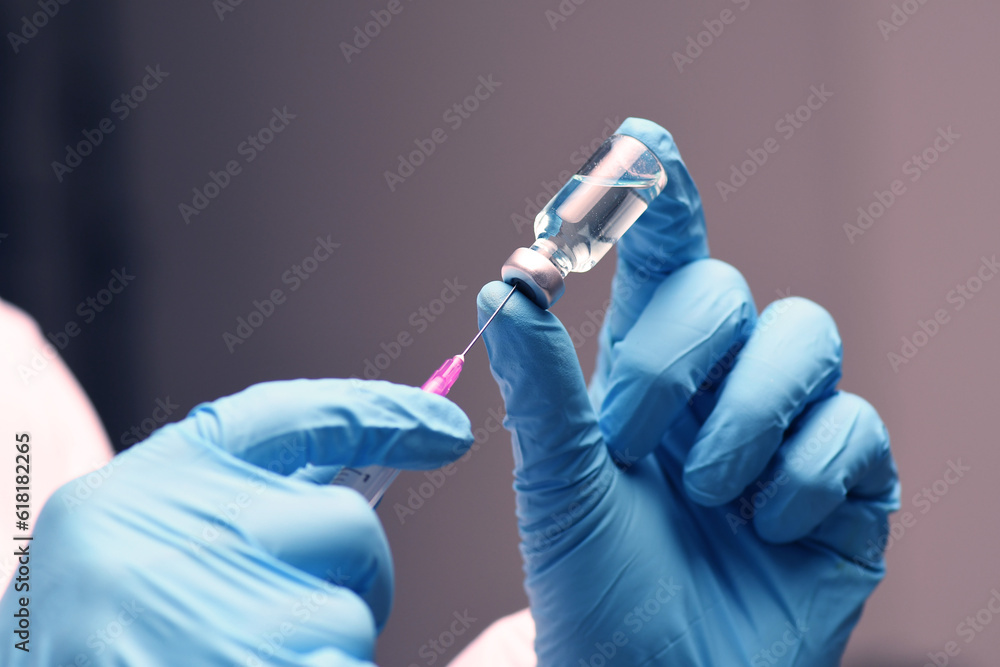 Ταπετσαρία Nurse hand in medical blue glove holding syringe covid-19 coronavirus vaccine liquid from bottle preparing injection coronavirus influenza vaccine vaccination concept