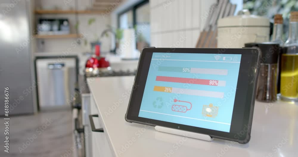 Tablet with smart home interface on white worktop in kitchen, slow motion Tablet with smart home interface on white worktop in kitchen, slow motion