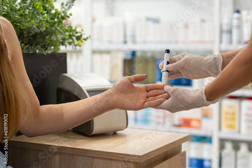 woman having a blood test in a pharmacy