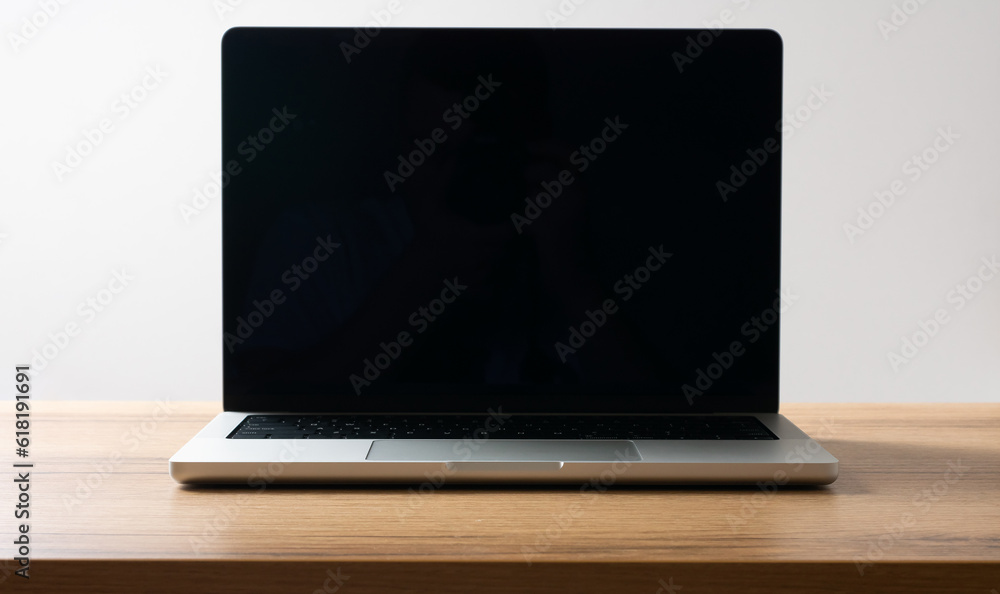 Fototapeta premium New modern silver laptop on the table