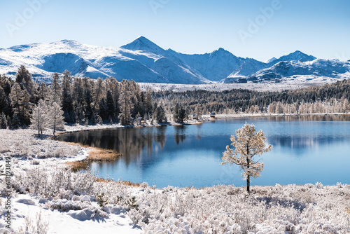 Kidelu lake in Altai mountains, Siberia, Russia. Snow-covered trees and mountains. © smallredgirl