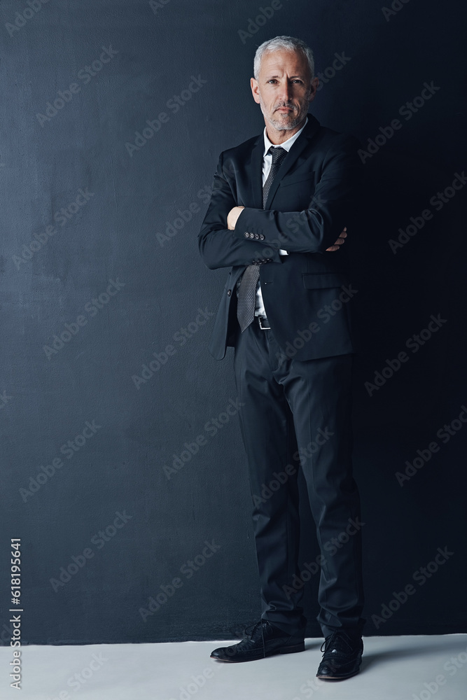 Naklejka premium Arms crossed, portrait and business man in studio for professional, corporate or manager. Boss, pride and confidence with face of senior male ceo on black background for executive and mockup space