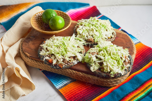 Traditional mexican blue sopes with cheese and beans photo