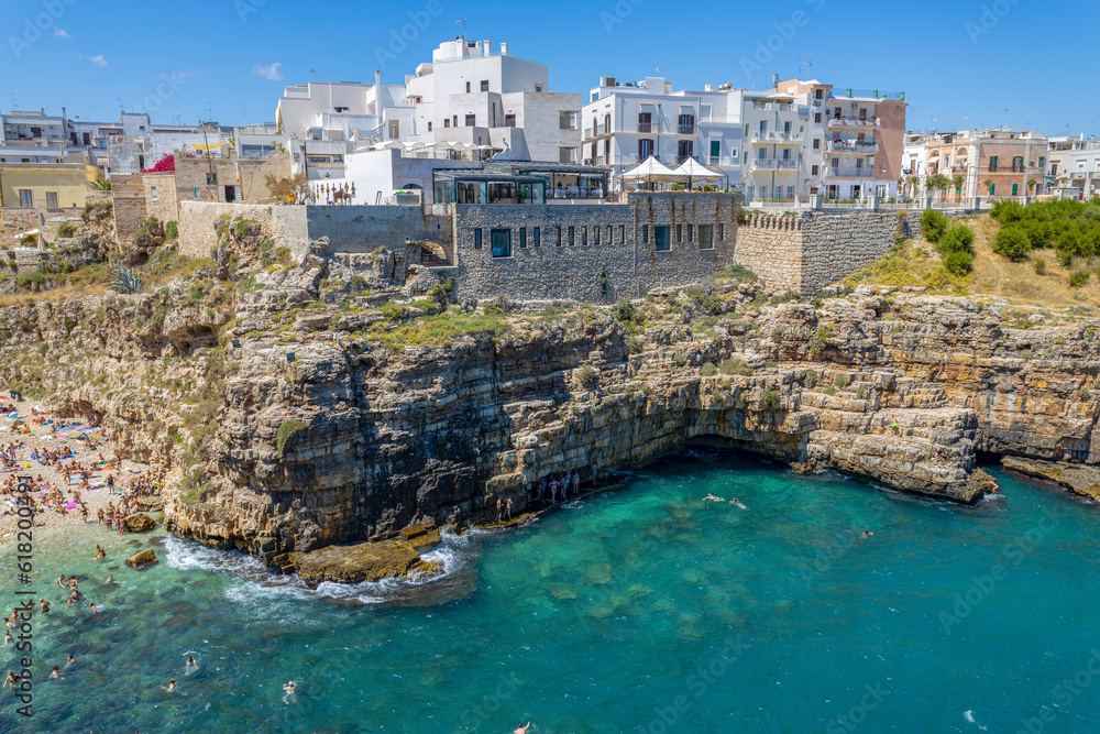POLIGNANO A MARE, ITALY, JULY 11, 2022 - View of the beach of Polignano a Mare, province of Bari, Puglia, Italy