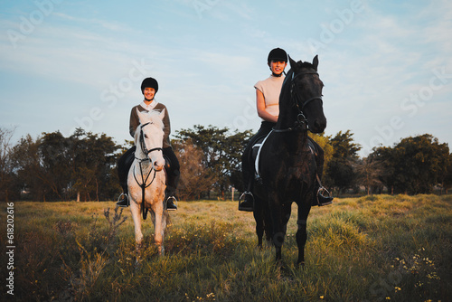 Horse ride, friends and countryside with animal, sunset and freedom on holiday and travel. Equestrian, people and field trip with pet in nature on vacation with rider in a meadow or ranch outdoor © Kirsten Davis/peopleimages.com