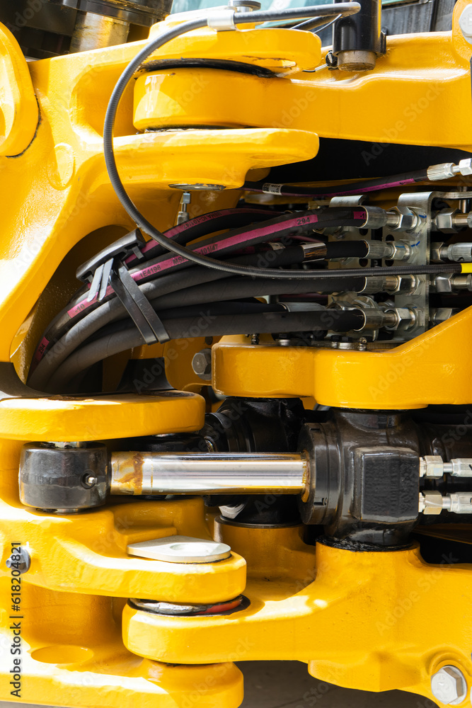 Hydraulic mechanisms of heavy loading equipment, close-up. Hydraulic mechanisms of heavy loading equipment, close-up.