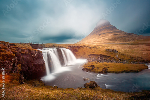 Kirkjufell mountain behind Kirkjufellfoss waterfall in Iceland.