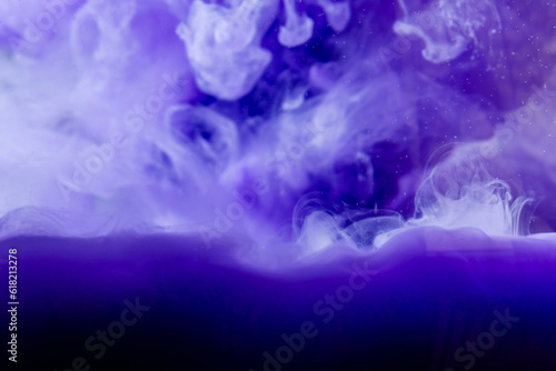 Ink water abstract burst.Color mist.Fantasy cloud.Blue paint flow.Purple creative abstract background.Blurred background.