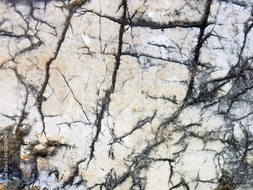 Background of gray stone in cracks