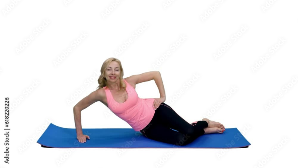 Smiling slim fit female in pink top doing fitness exercise sitting on mat, Full HD footage with alpha transparency channel isolated on white background Smiling slim fit female in pink top doing fitness exercise sitting on mat, Full HD footage with alpha transparency channel isolated on white background