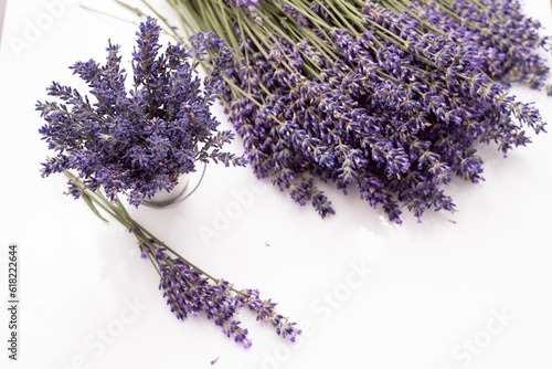 Fresh flowers of lavender bouquet on a white wooden background