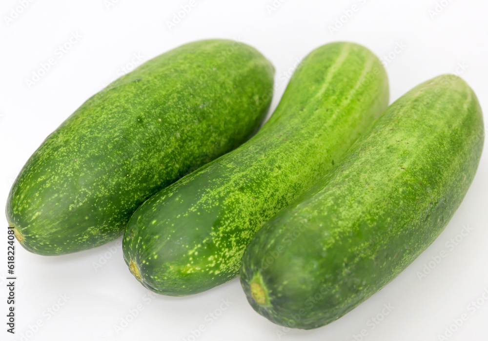 Fresh green and healthy cucumbers on wooden board Fresh green and healthy cucumbers on wooden board
