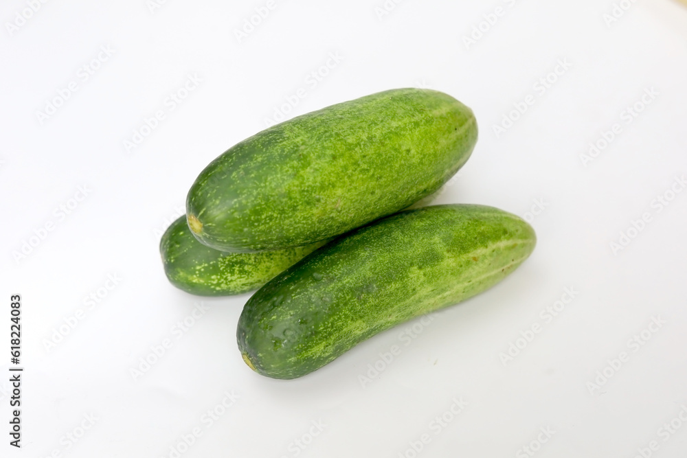 Fresh green and healthy cucumbers on wooden board Fresh green and healthy cucumbers on wooden board