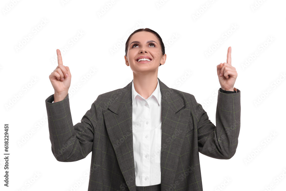 Beautiful businesswoman in suit pointing at something on white background Beautiful businesswoman in suit pointing at something on white background