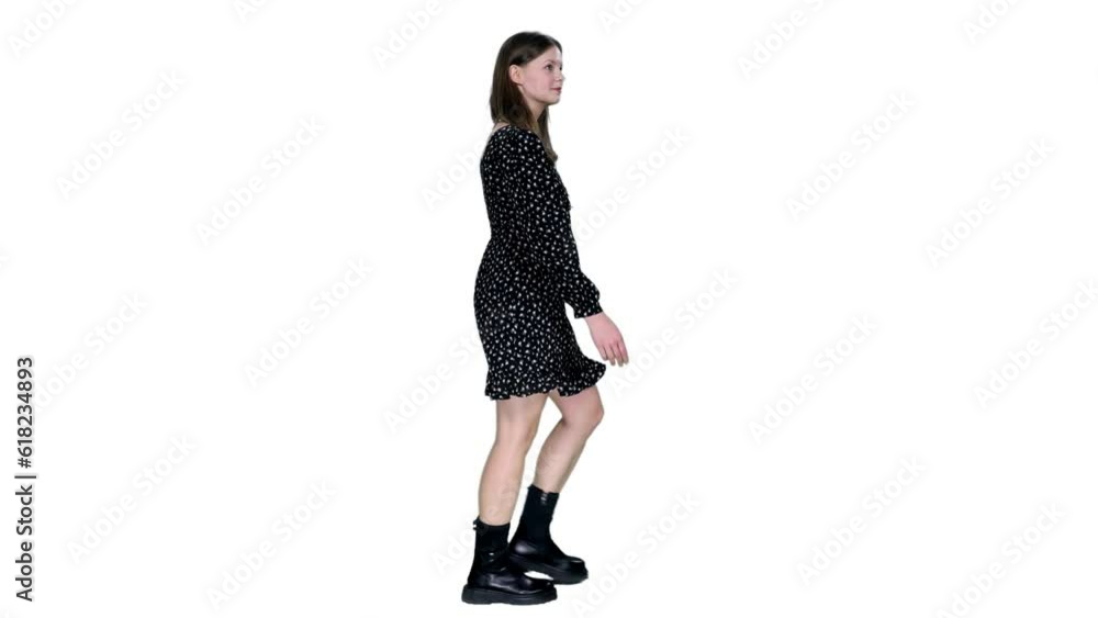 Side view young adult trendy style smiling girl walking in dress and black boots, Full HD footage with alpha transparency channel isolated on white background Side view young adult trendy style smiling girl walking in dress and black boots, Full HD footage with alpha transparency channel isolated on white background