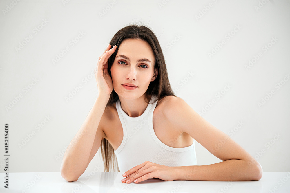 beauty model posing at studio, looking at camera beauty model posing at studio, looking at camera