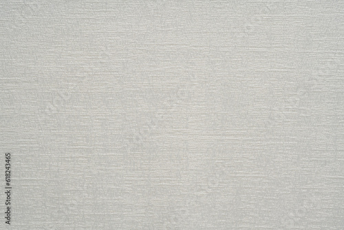 White fabric texture with an abstract pattern.