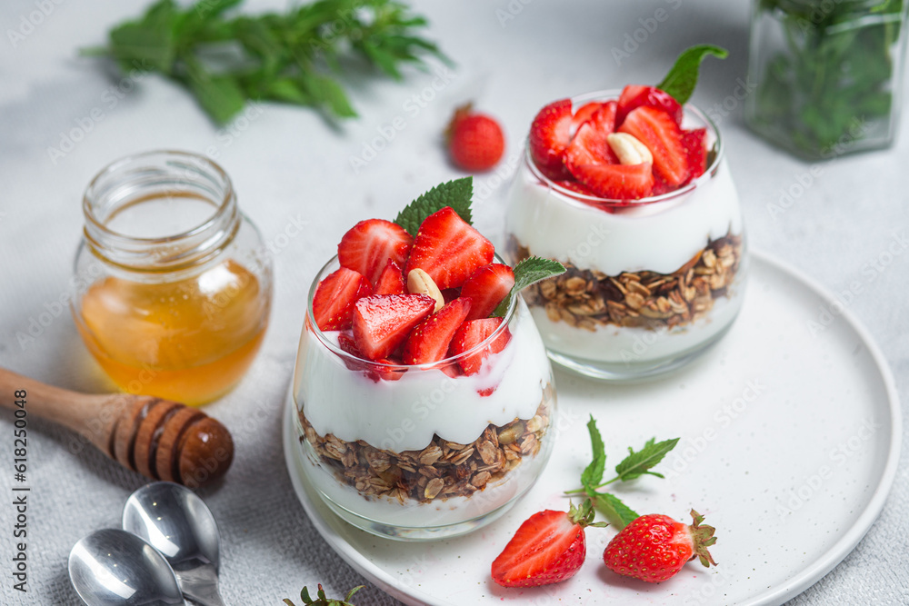 Granola with yogurt and strawberries in a glass Granola with yogurt and strawberries in a glass