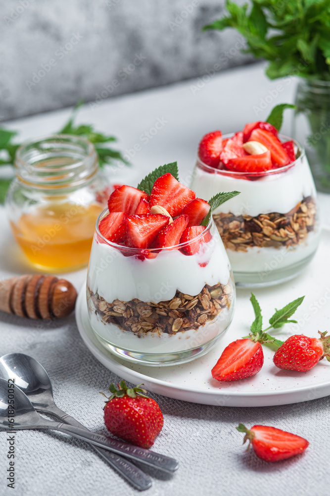 Granola with yogurt and strawberries in a glass Granola with yogurt and strawberries in a glass