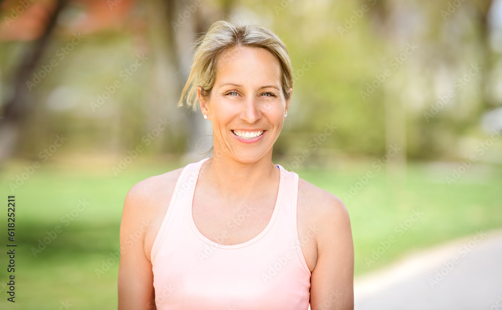 Female Runner Jogging during Outdoor Workout in a Park Female Runner Jogging during Outdoor Workout in a Park