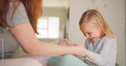 Mother, girl kid and laughing for tickle in bedroom with love, care or quality time to relax together. Happy child smile, giggle or play funny game with silly mom at home for comedy, humor or bond