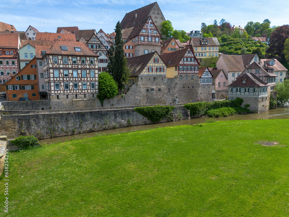 Schwaebisch Hall, half-timbered old town houses with a view of the church tower, drone shot
