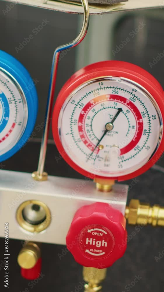 Vertical video Close up shot of professional ac gauges vacuum pump used