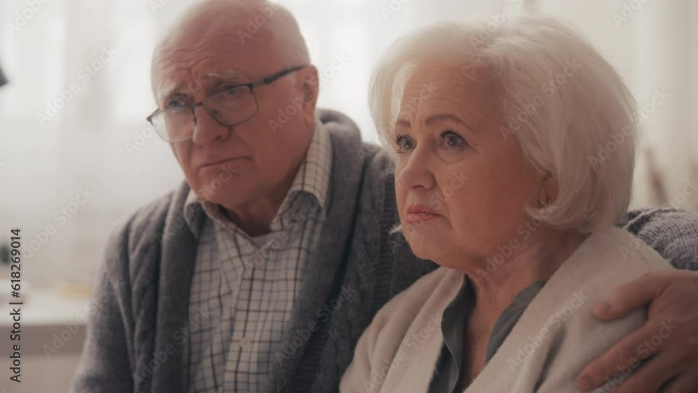 Upset senior couple hearing diagnosis during doctor's visit at home, bad news Upset senior couple hearing diagnosis during doctor's visit at home, bad news