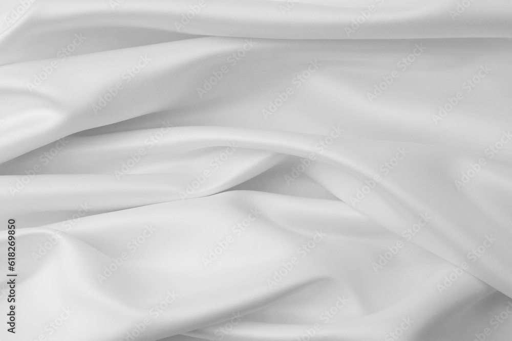 Rippled white silk fabric texture background
