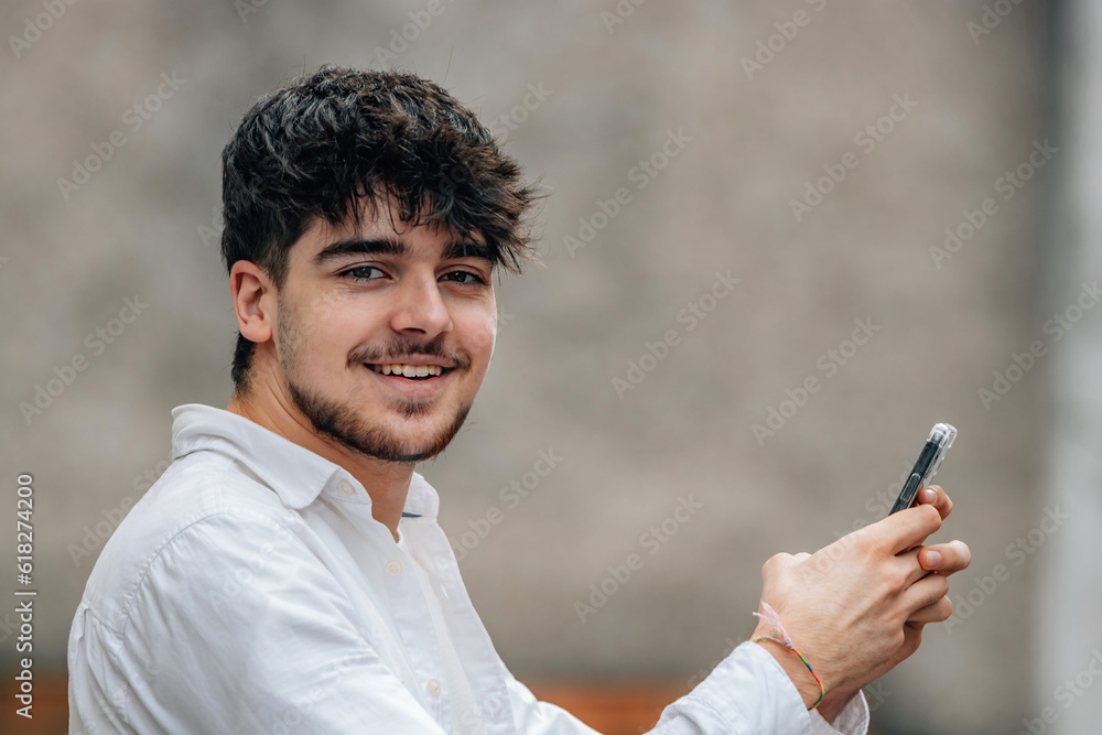 portrait of boy with mobile phone