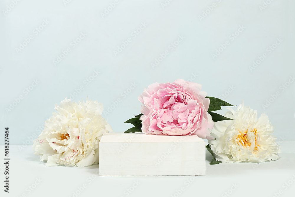 Abstract background with natural wooden podium and peonies flowers, empty showcase for display or presentation of cosmetic products, minimal flower arrangement, romance style