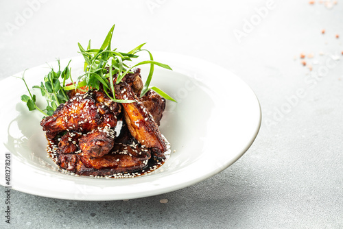 Baked chicken wings with sesame and sauce, Restaurant menu, dieting, cookbook recipe top view