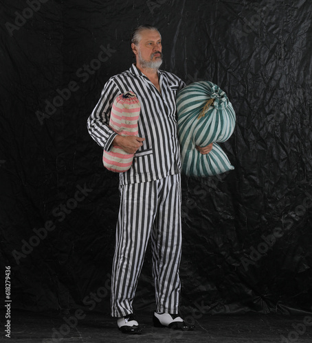 man in prison striped clothes
