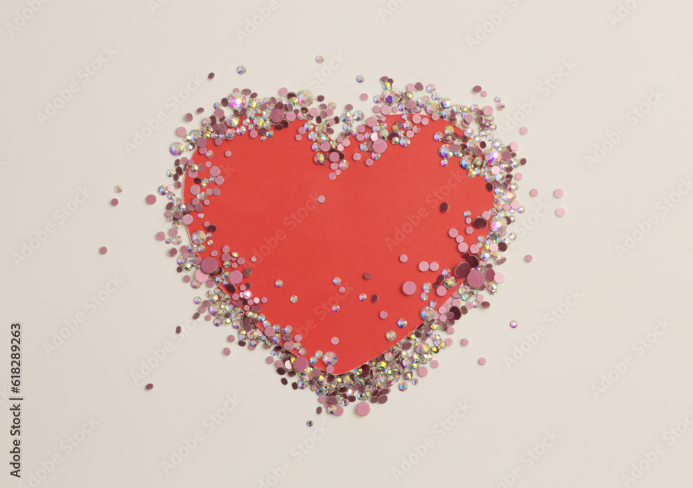 Glow sparkle rhinestones glitter heart paper frame blank. Abstract copy space texture beige background.