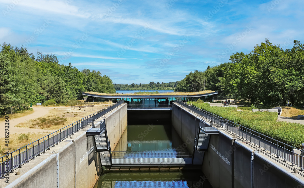 Leukermeer - Reindersmeer, Netherlands - July 9. 2023:  Water canal between two lakes with sluice gate and visitor center