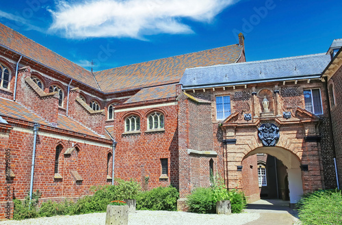 Boxmeer (St. Petrus basilica), Netherlands - July 9. 2023: Beautiful courtyard of neo gothic style dutch church, archway