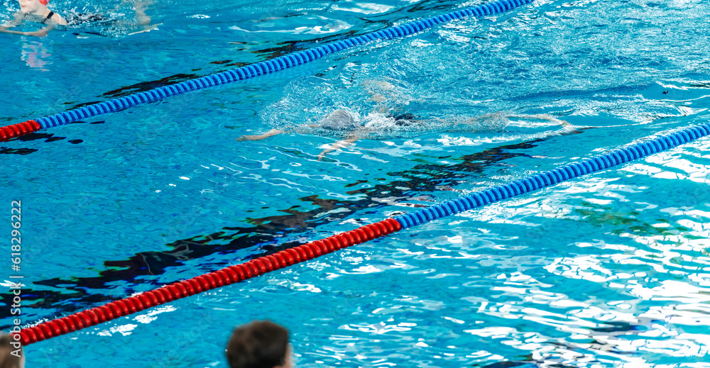 athlete swimmer swims underwater in the pool