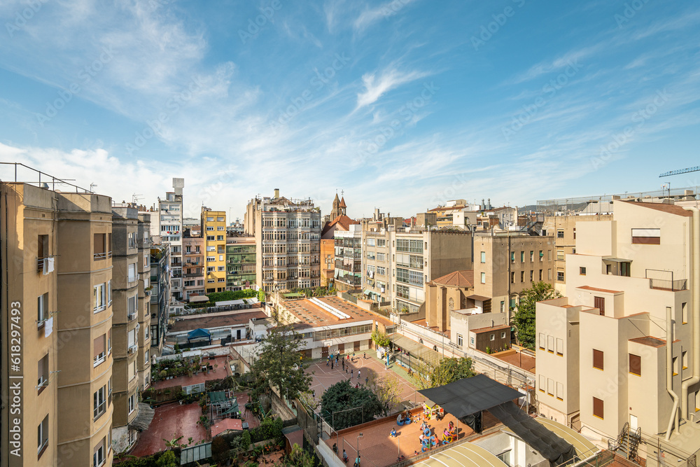 Cityscape of residential district in barcelona with impressive architecture against a clear sky