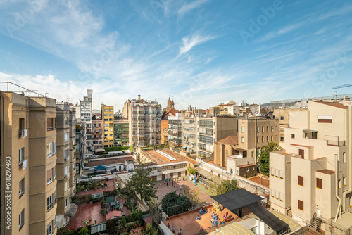 Cityscape of residential district in barcelona with impressive architecture against a clear sky