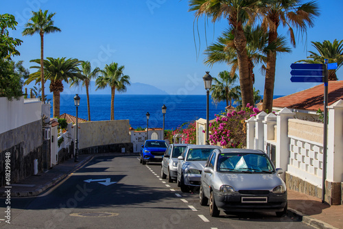 Fototapeta Naklejka Na Ścianę i Meble -  Cars parked at the streets of Puerto de Santiago, Tenerife, Spain